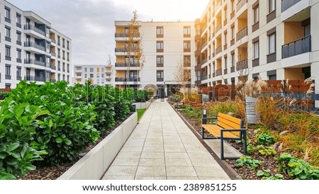 Courtyard in a residential building block of flats Royalty-Free Stock Photo #2389851255