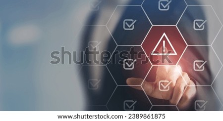 Problem and error warning concept. Businessman touching on triangle caution warning sign, automatic warning system for notification error and maintenance. Incident, risk, contingency management.  Royalty-Free Stock Photo #2389861875