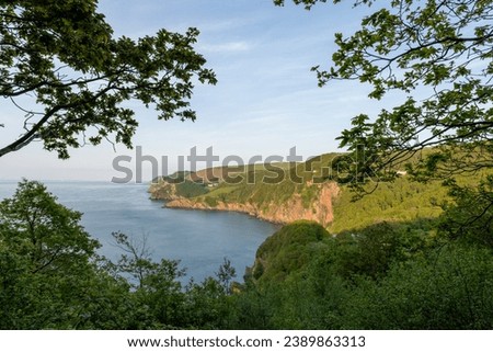 View from the South West Coastpath of the North Devon coastline at Woody Bay Royalty-Free Stock Photo #2389863313