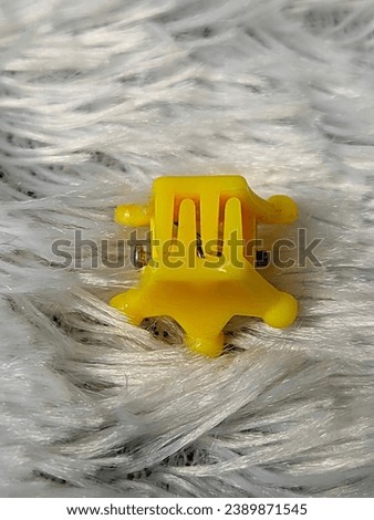Children's hair clips that are cute and yellow in color