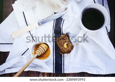Flat Lay Photography of White Knife Honey Dipper on Bowl And