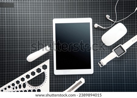 digital tablet and office supplies