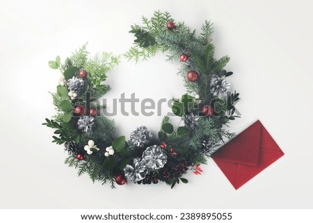 christmas wreath and red envelope