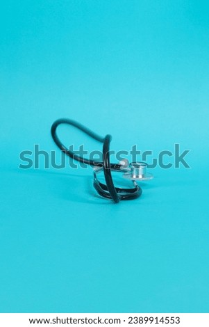 Stethoscope isolated on blue background. Health checkup. Healthcare and medicine background. Diagnostic medical tool for patient diagnosis. Cardiology doctor equipment for heartbeat test. Royalty-Free Stock Photo #2389914553