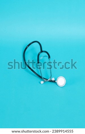 Stethoscope isolated on blue background. Health checkup. Healthcare and medicine background. Diagnostic medical tool for patient diagnosis. Cardiology doctor equipment for heartbeat test. Royalty-Free Stock Photo #2389914555