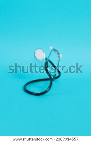 Stethoscope isolated on blue background. Health checkup. Healthcare and medicine background. Diagnostic medical tool for patient diagnosis. Cardiology doctor equipment for heartbeat test. Royalty-Free Stock Photo #2389914557