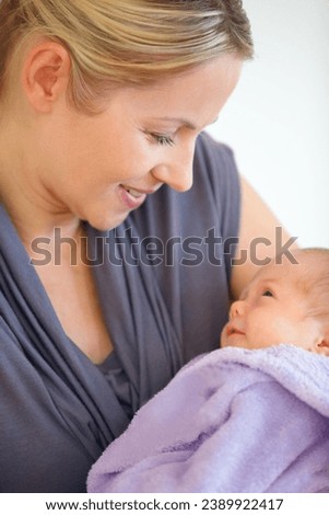 Closeup, woman and holding of baby in home for love, care or bonding in relationship. Female person, motherhood and looking at child for hope, future or new life for development, milestone or growth