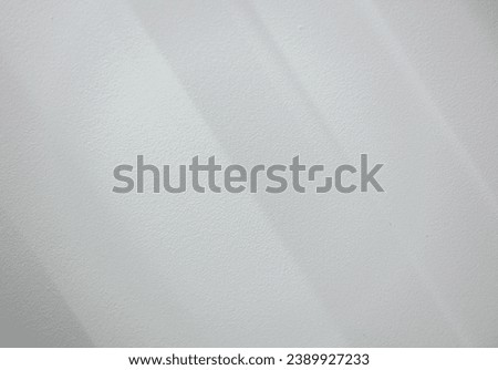 Background or texture of soft sunlight on white wall. Minimalist background with copy space.