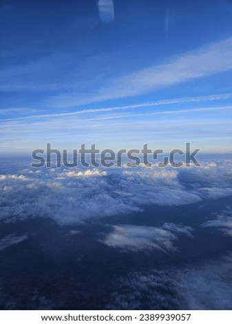 Magnificent sky and cloud picture taken from inside the plane