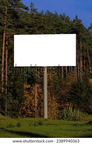 Background for design. Advertising billboard along the road in the city on a autumn sunny day
