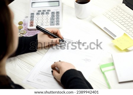 Accountant fill german tax form Einkommensteuererklarung in end of tax period. Taxation and paperwork routine in Germany