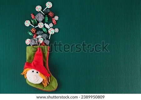 The Befana with sweet coal and candy. Italian Epiphany day tradition. Royalty-Free Stock Photo #2389950809