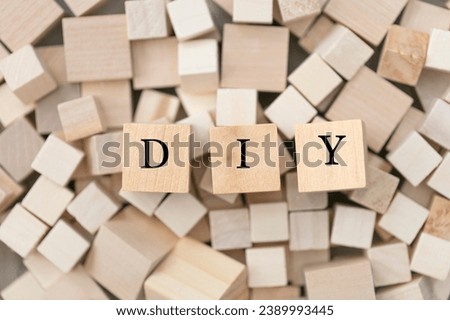 DIY (do it yourself) concept. Abstract geometric wooden dice. DIY  icon.  Royalty-Free Stock Photo #2389993445