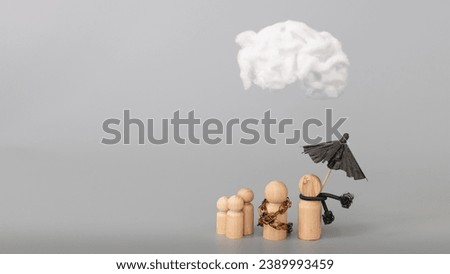 Psychology, solitude, fear, dependence or mental health problem concept. Dysfunctional family concept. Depressed sad person with a cloud overhead hiding in a bag, on grey background. Copy space. Royalty-Free Stock Photo #2389993459