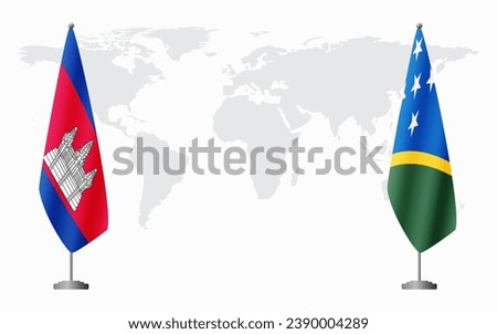 Cambodia and Solomon Islands flags for official meeting against background of world map.