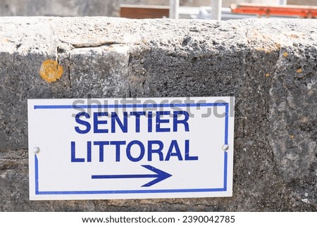 sentier littoral means coastal path in text french sign with arrow coastal trail direction in France