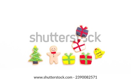 Christmas cookies in the form of sweaters and socks, gifts, Christmas tree, snowflakes, cane, snowman, leaves. Christmas decoration, exchange of gifts