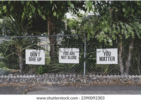 don't give up. You are not alone, you matter signage on metal fence
 Royalty-Free Stock Photo #2390092303