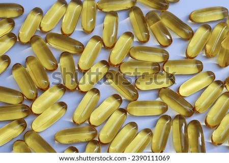 stack of fish oil capsules on white background.  soft capsule concept with omega 3 and vitamin D