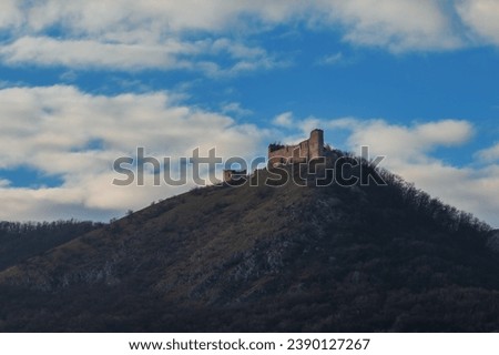 Landscape with the ruins of Devicky Castle - Moravia - Czech Republic. Blue sky with white clouds.