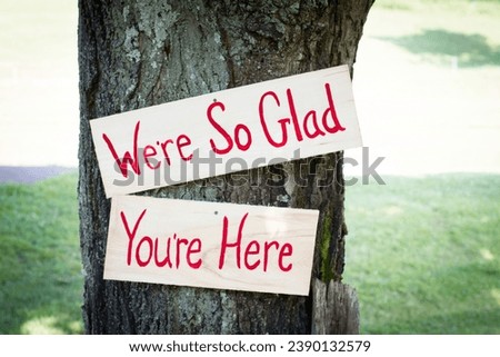 We’re so glad you’re here inspirational sign | rustic wooden sign Royalty-Free Stock Photo #2390132579
