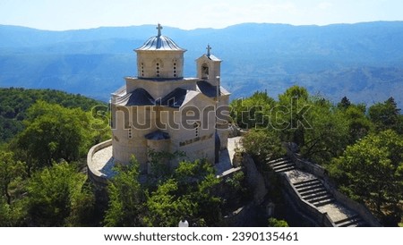 The Saint Stanko, Svetog Stanka church (aerial shoot). Lower church of Ostrog monastery complex in the mountains of Montenegro. Royalty-Free Stock Photo #2390135461