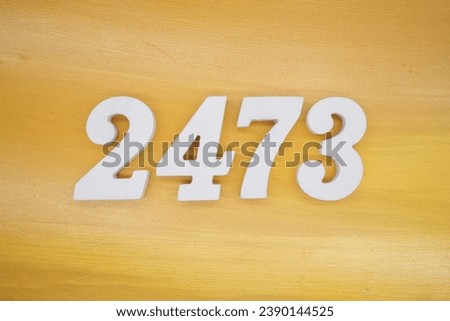 The golden yellow painted wood panel for the background, number 2473, is made from white painted wood.