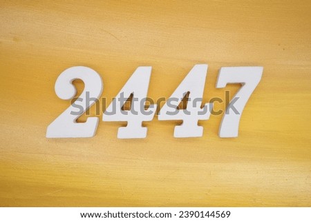 The golden yellow painted wood panel for the background, number 2447, is made from white painted wood.