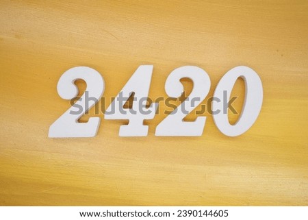 The golden yellow painted wood panel for the background, number 2420, is made from white painted wood.