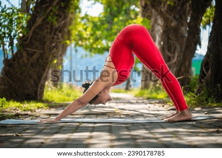Young woman practicing yoga in the nature.