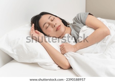 Wellness lifestyles concept, Young women sleep well on the bed with good condition and clean bedchamber Royalty-Free Stock Photo #2390188957