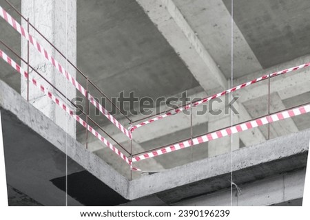 Red and White Lines of barrier tape, staircase fencing at a construction site.