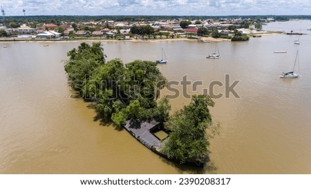 Aerial shot of ancient slave boat with lush vegetation aerial French Guiana