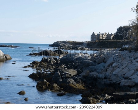 A beautiful beach picture from Rhode Island with mansions in the  background.