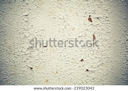 Rusted white metal wall with cracks on paint, background texture with vintage toned photo filter effect, instagram style