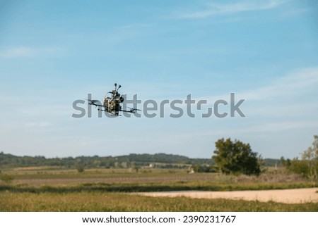 Cinematic UAV soaring for aerial shots in daylight. Royalty-Free Stock Photo #2390231767