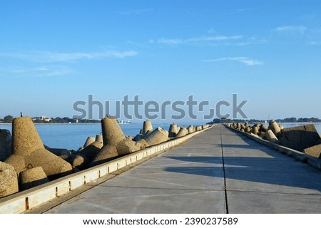 Baltiysk, Kaliningrad region, Southern pier on the Baltic spit, northern pier, concrete breakwaters Royalty-Free Stock Photo #2390237589