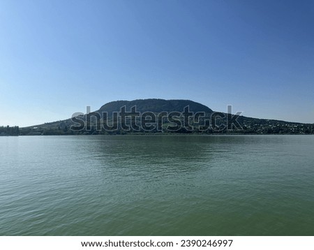 A summer picture of the Badacsony mountain taken from a boat.