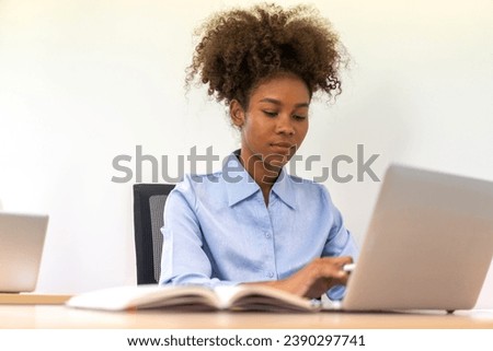 Young black african woman relaxing using laptop computer working and startup idea at office.Young creative african woman working and typing on keyboard smart  online at company