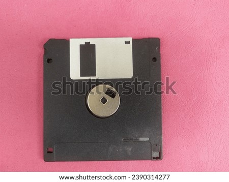 1.44 Mb 3.5 inch floppy disk isolated on pink background. Floppy diskette. 