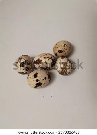 A group of cooked quail eggs on a white table, for children's breakfast before going to school, photo taken in the morning.