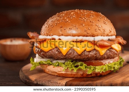 salad burger with cheddar and bacon in wooden background Royalty-Free Stock Photo #2390350595