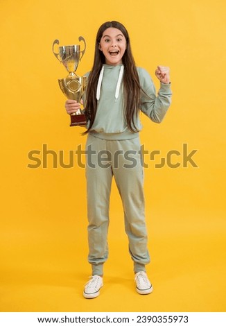 sport success and victory. teen girl holding champion cup. girl winner in sport. successful sport and childhood of teen. being true champion. celebrating success. teen girl champion. Champion glory Royalty-Free Stock Photo #2390355973