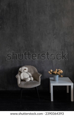 white coffee table tulips armchair in dark room interior