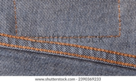 Seams on jeans close-up in high-resolution. Stitching on denim on the inside. Fabric texture. Blue jeans background and texture. Denim texture on the underside of the textile
