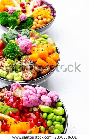 Vegan buddha bowls set with pumpkin, quinoa, tomatoes, spinach, avocado, radish, soybeans, edamame, tofu, cabbage and seeds, white background, top view. Autumn or winter winter menu, slow comfort food
