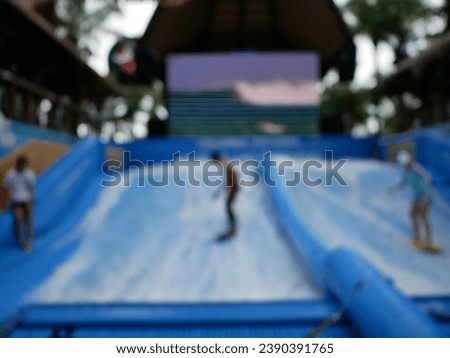 Blur focus of Extreme athlete having fun wakeboarding in summer. Royalty-Free Stock Photo #2390391765