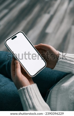 cell phone blank white screen mockup.woman hand holding texting using mobile at office.