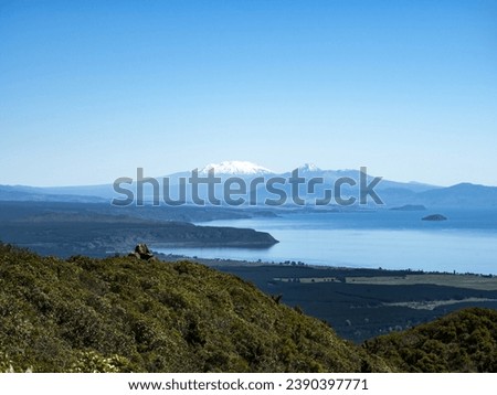 Snow-covered Mount Ruapehu and Lake Taupo from Tauhara hill top lookout
