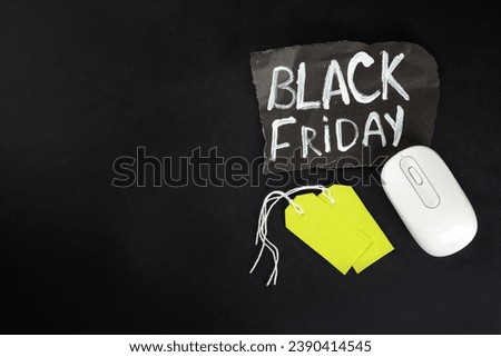 Black friday sale background with sale tags, clothes, laptop, headphones, smartphone, tablet, sale items, flat lay top view copy space